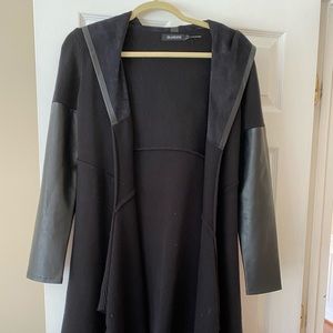 Black with faux leather sleeves and hood